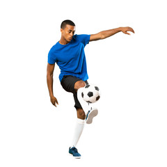 Full-length shot of African American football player man over isolated white background © luismolinero