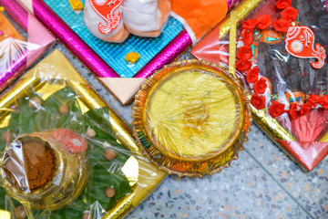 Bengali marriage rituals with various sweet decorations for bride and groom in India