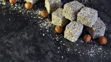 turkish delight with hazelnuts on a black background