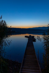 Fototapeta premium fishing boat at pier on Jenoi pond near Diosjeno, Northern Hungary