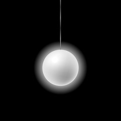 white glowing ball hanging on a thread