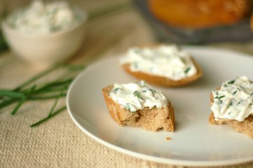 Slices of bread with chives spread