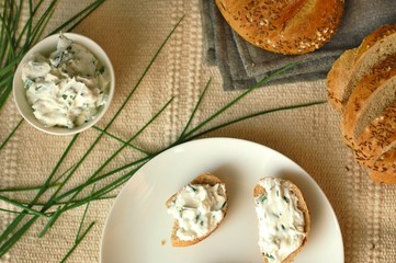 Slices of bread with chives spread