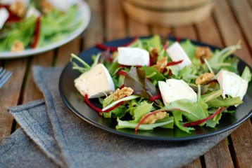 Fresh salad with lettuce, beetroot, walnut and camembert cheese