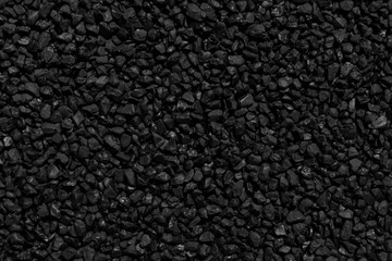 Fototapeta premium Natural fire ashes with dark grey black coals texture. It is a flammable black hard rock. Space for text.