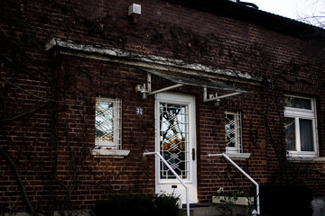 white door on a redbrick house