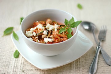 Zucchini spaghetti in sauce with tomato, basil, meat and cheese