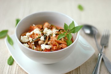 Zucchini spaghetti in sauce with tomato, basil, meat and cheese