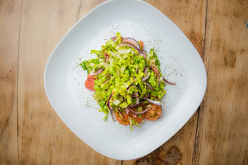 Pink grapefruit and little gem salad served on a white plate - summer salad recipe