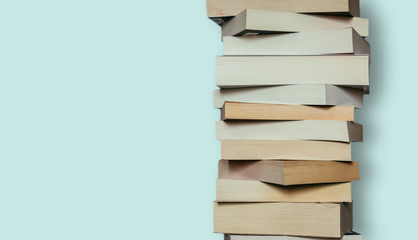 Literature for study: Stack of books; grey background