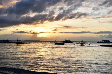 sunrise on a tropical island with a white sandy beach in the philippines