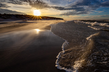 A beach after a storm during a windy evening in the Slowinski National Park. Czolpino, Leba, Poland.