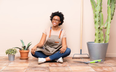 Gardener woman sitting on the floor