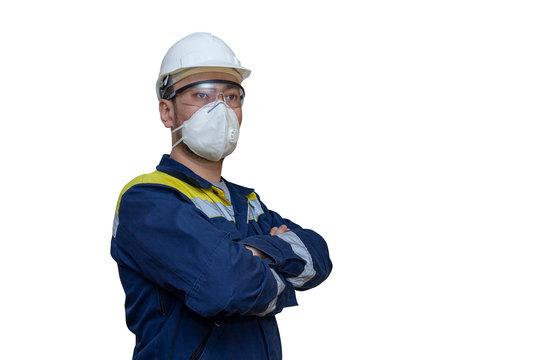 Protective equipment use work industry. Worker in a white hard hat, respirator and safety glasses on a white background