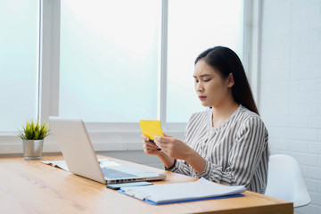 businesswoman working on laptop in office