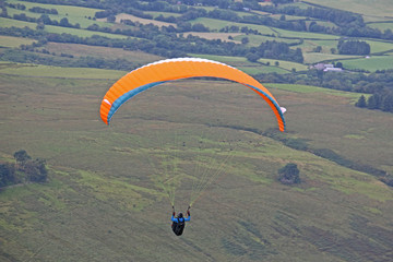 Paraglider flying in the Brecon Beacons, Wales
