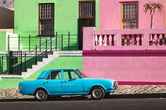 Old blue car in front of colorful houses, Bo-Kaap, Capetown