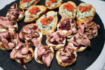 Canapes and appetizers on a table, close up. Catering service buffet