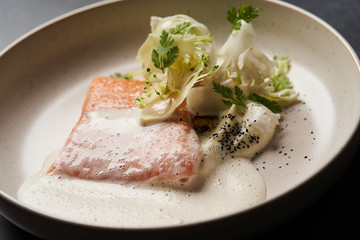 Trout fish sous vide with mashed cauliflower and mussel sauce