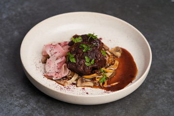 Lamb meat with pickled radish, mushrooms and demi glace sauce