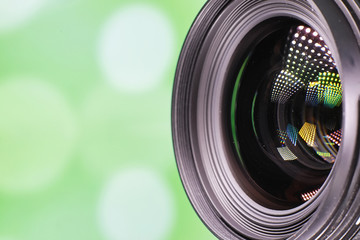 Equipment videographer and photographer. Lenses on the table against the background of bright...