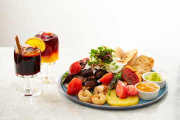 Sangria, Spanish alcoholic beverage with beef steak and salad 