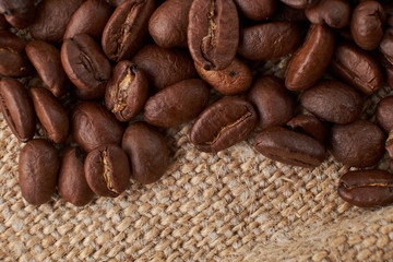 Coffee Cup and coffee beans on the table close-up
