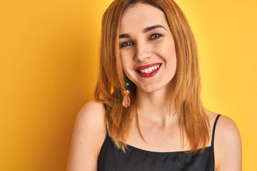 Close up of caucasian elegant woman over isolated yellow background with a happy face standing and smiling with a confident smile showing teeth