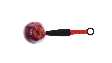 throwing knives and red apple isolated on white background