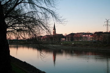 Fototapeta premium the riverside town at sundown