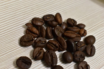Roasted coffee beans on a substrate.