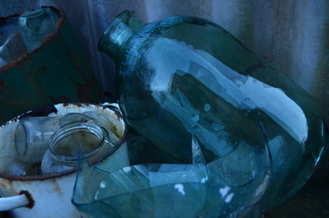 glass bottle and jars on the table