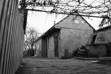 black and white photo of an abandoned village house