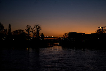 Fototapeta na wymiar bridge and city lights at sundown