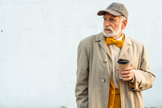 Stylish Elderly Gentleman Is Looking Away Outdoors