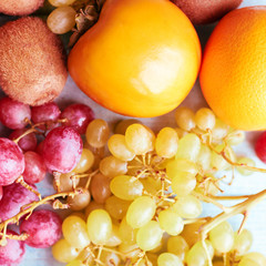  Background of fruits. Grapes, Kiwi and Persimmon