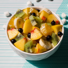 Fruit salad on a colored background