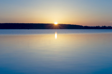 Beautiful view for sunrise over calm water of river. Morning landscape.