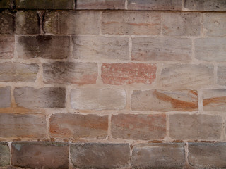Sand bricks. Old wall made of natural sandstone.