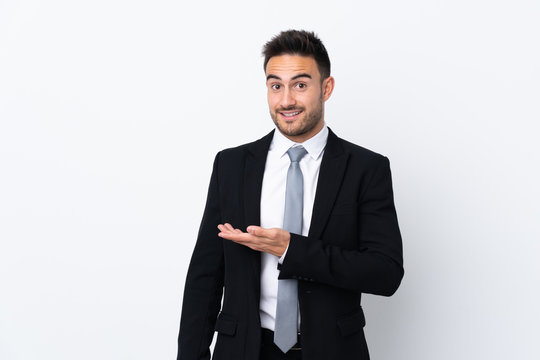 Young business man over isolated background extending hands to the side for inviting to come