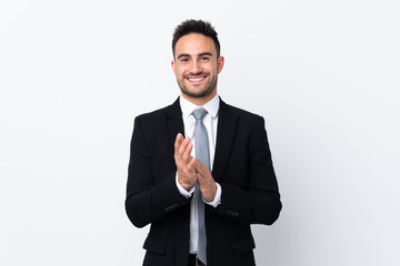 Young business man over isolated background applauding