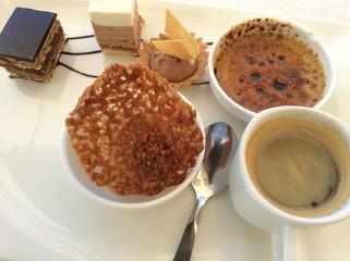 cup of coffee and cake on wooden table