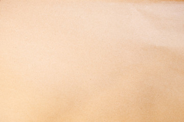 Old texture brown yellow style vintage cardboard sheet of empty paper background.