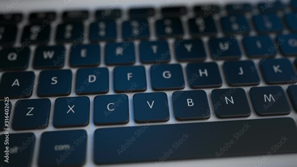 Poster keyboard of a modern laptop. smooth flight over the keyboard. animation of a camera with depth of fi