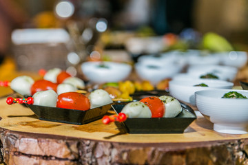 Detail of a canapes of a meal at an event, wedding, meeting or congress with food. Canapes decorated on the dish