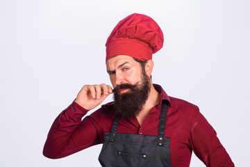 Cook man in chef uniform. Professional chef man. Cooking. Profession. Business. Chef, cook, baker in hat and apron. Chief cook and professional culinary.