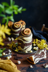 Easter chocolate cake cruffin on wooden table. Homemade Orthodox pastries.  Sliced piece of cake. Easter bread Kulich. Selective focus