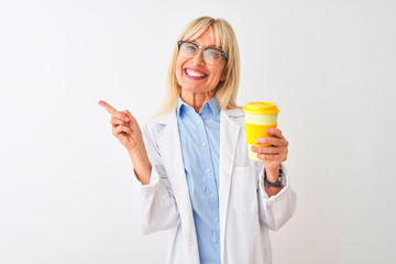 Middle age scientist woman wearing glasses drinking coffee over isolated white background very happy pointing with hand and finger to the side