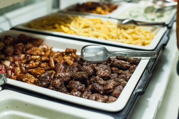 Tasty mixed grilled meat serving at restaurant