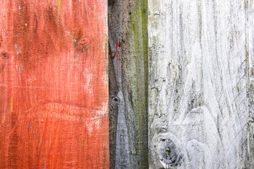 A Grey And Orange Wooden Fence.